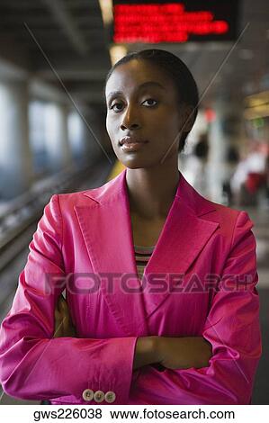 Portrait of a businesswoman standing with her arms crossed at a subway station View Large Photo Image Stock Photo - Portrait of a businesswoman standing with her arms crossed at a subway station. Fotosearch