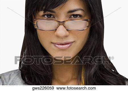 Stock Photo - Portrait of a young woman wearing eyeglasses. Fotosearch