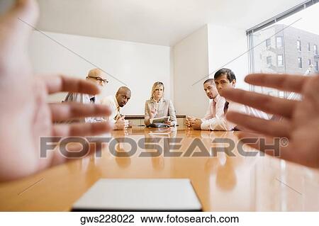Business executives discussing in a meeting View Large Photo Image Stock Image - Business executives discussing in a meeting. Fotosearch