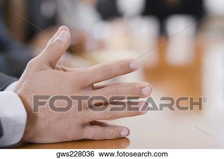 Stock Photograph - Close-up of a person's hands. Fotosearch