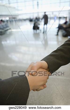 Close-up of two business executives shaking hands View Large Photo Image Stock Photo - Close-up of two business executives shaking hands. Fotosearch