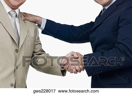 Close-up of two businessmen shaking hands View Large Photo Image Stock Photo - Close-up of two businessmen shaking hands. Fotosearch