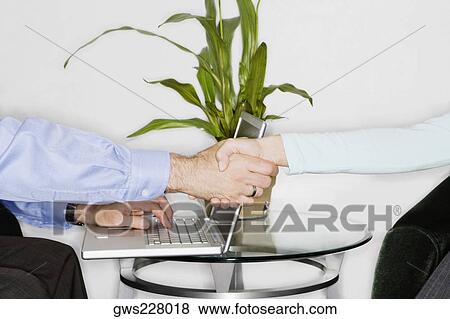 Close-up of two businessmen shaking hands View Large Photo Image Stock Photo - Close-up of two businessmen shaking hands. Fotosearch