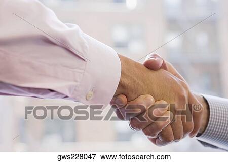 Close-up of two businessmen shaking hands View Large Photo Image Stock Photo - Close-up of two businessmen shaking hands. Fotosearch