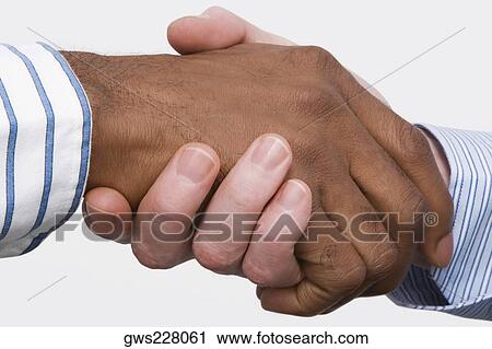 Close-up of two businessmen's shaking hands View Large Photo Image Stock Image - Close-up of two businessmen's shaking hands. Fotosearch