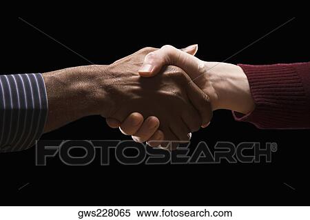 Close-up of two businessmen's shaking hands View Large Photo Image Stock Photography - Close-up of two businessmen's shaking hands. Fotosearch