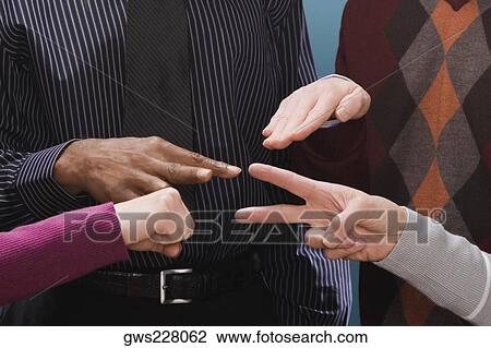 Four business executives making hand signs View Large Photo Image Stock Image - Four business executives making hand signs. Fotosearch