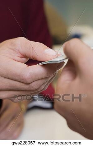 Receptionist's hand giving the cardkey to a customer View Large Photo Image Stock Photo - Receptionist's hand giving the cardkey to a customer. Fotosearch