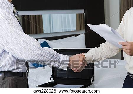 Two businessmen shaking hands View Large Photo Image Stock Photograph - Two businessmen shaking hands. Fotosearch