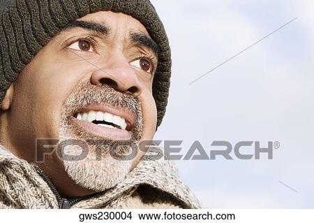 Close-up of a mature man smiling View Large Photo Image Picture - Close-up of a mature man smiling. Fotosearch