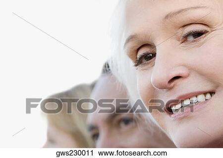 Close-up of a senior woman smiling View Large Photo Image Stock Image - Close-up of a senior woman smiling. Fotosearch