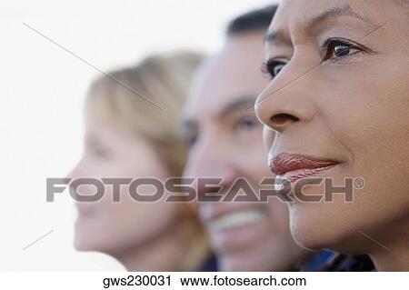 Close-up of a senior woman with her friends View Large Photo Image Stock Image - Close-up of a senior woman with her friends. Fotosearch