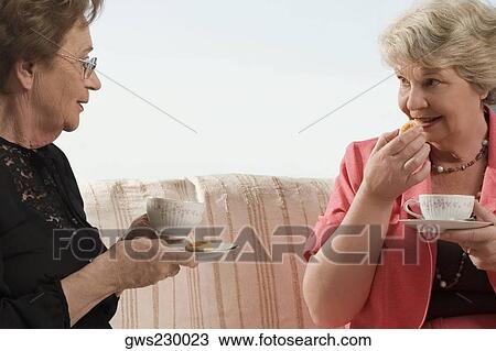 Two senior woman having breakfast View Large Photo Image Stock Image - Two senior woman having breakfast. Fotosearch
