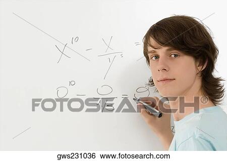 Portrait of a teenage boy writing on a whiteboard View Large Photo Image Stock Photograph - Portrait of a teenage boy writing on a whiteboard. Fotosearch