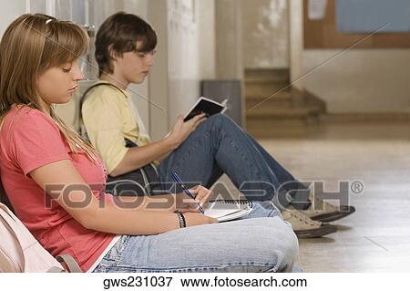 Side profile of a teenage girl and a teenage boy studying View Large Photo Image Stock Photo - Side profile of a teenage girl and a teenage boy studying. Fotosearch