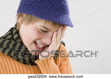 Close-up of a boy covering his eyes with his hands View Large Photo Image Picture - Close-up of a boy covering his eyes with his hands. Fotosearch