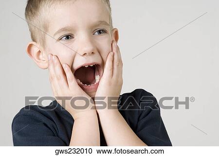 Close-up of a boy shouting View Large Photo Image Stock Image - Close-up of a boy shouting. Fotosearch