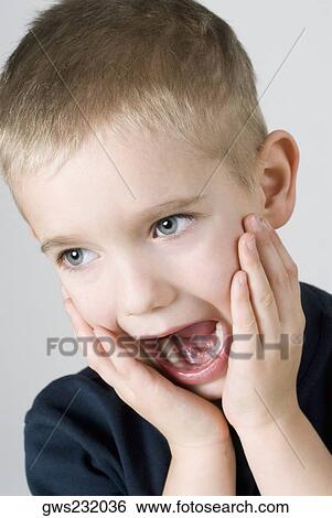 Stock Photograph - Close-up of a boy shouting. Fotosearch