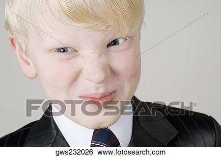 Close-up of a boy smirking View Large Photo Image Stock Photograph - Close-up of a boy smirking. Fotosearch