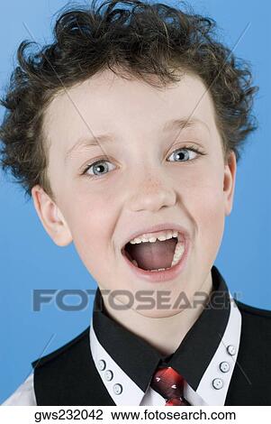 Close-up of a boy with his open mouth View Large Photo Image Stock Image - Close-up of a boy with his open mouth. Fotosearch
