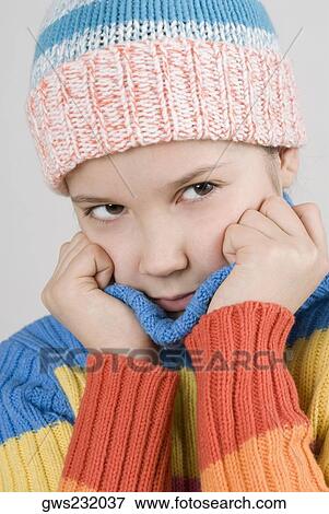 Stock Photo - Close-up of a girl holding her sweater. Fotosearch