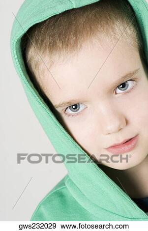 Stock Photo - Portrait of a boy looking angry. Fotosearch