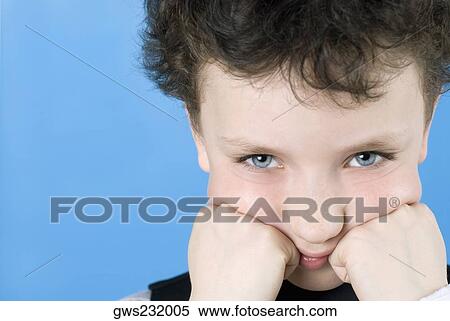 Portrait of a boy with his hands on his cheeks View Large Photo Image Stock Photography - Portrait of a boy with his hands on his cheeks. Fotosearch