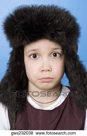 Portrait of a girl wearing a fur hat View Large Photo Image Stock Photo - Portrait of a girl wearing a fur hat. Fotosearch