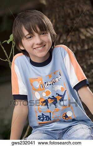 Portrait of a schoolboy smiling View Large Photo Image Stock Image - Portrait of a schoolboy smiling. Fotosearch