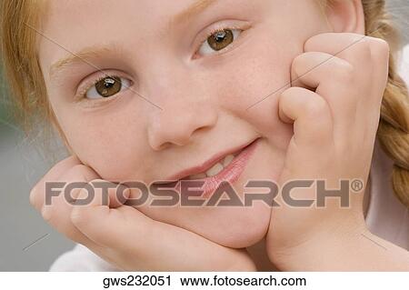 Portrait of a schoolgirl smiling View Large Photo Image Stock Image - Portrait of a schoolgirl smiling. Fotosearch