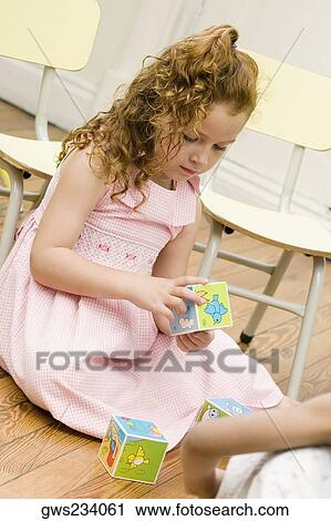 Girl playing with blocks View Large Photo Image Stock Image - Girl playing with blocks. Fotosearch