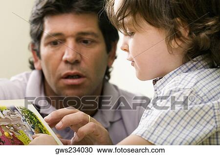 Male teacher teaching his student View Large Photo Image Stock Image - Male teacher teaching his student. Fotosearch