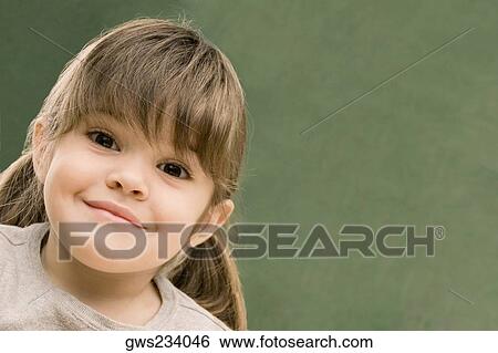 Portrait of a girl smirking View Large Photo Image Stock Photograph - Portrait of a girl smirking. Fotosearch