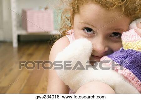 Portrait of a girl with a toy View Large Photo Image Stock Photograph - Portrait of a girl with a toy. Fotosearch