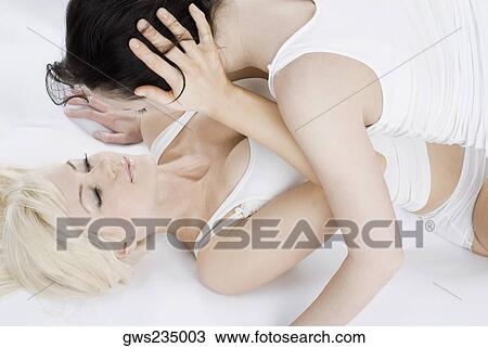 Female homosexual couple embracing each other View Large Photo Image Stock Image - Female homosexual couple embracing each other. Fotosearch