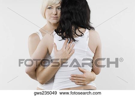 Female homosexual couple embracing each other View Large Photo Image Stock Photo - Female homosexual couple embracing each other. Fotosearch