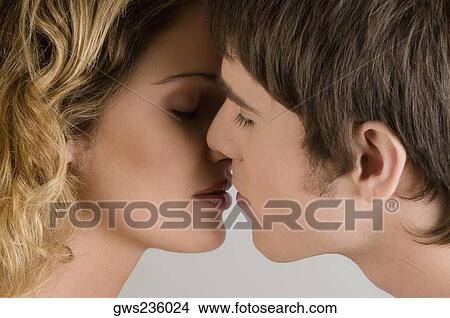 Picture - Close-up of a young couple romancing. Fotosearch