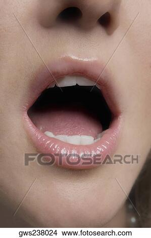 Close-up of a young woman yawning View Large Photo Image Picture - Close-up of a young woman yawning. Fotosearch