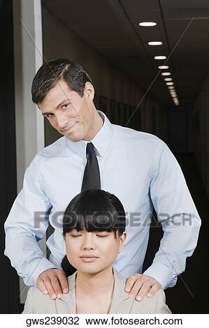 Close-up of a businesswoman with a businessman standing beside her View Large Photo Image Stock Image - Close-up of a businesswoman with a businessman standing beside her. Fotosearch