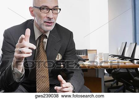 Portrait of a businessman gesturing View Large Photo Image Stock Photo - Portrait of a businessman gesturing. Fotosearch
