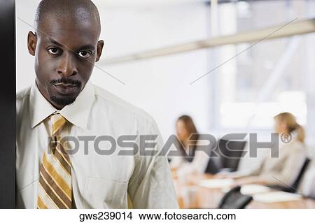 Picture - Portrait of a businessman looking serious. Fotosearch