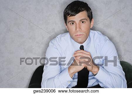 Portrait of a businessman thinking View Large Photo Image Stock Photograph - Portrait of a businessman thinking. Fotosearch