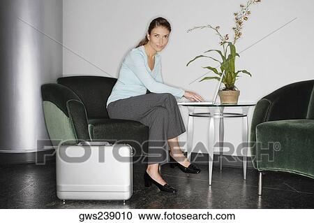 Portrait of a businesswoman using a laptop View Large Photo Image Stock Image - Portrait of a businesswoman using a laptop. Fotosearch
