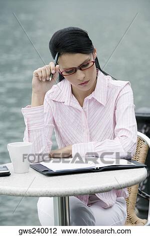Close-up of a businesswoman thinking View Large Photo Image Stock Image - Close-up of a businesswoman thinking. Fotosearch