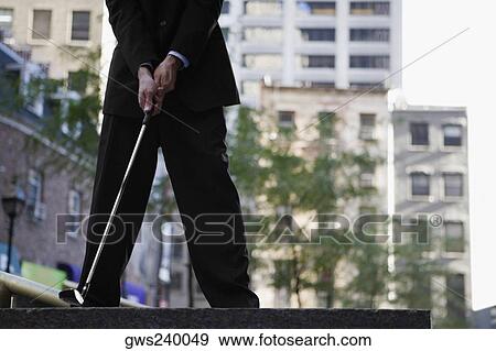 Low section view of a businessman playing golf View Large Photo Image Stock Photo - Low section view of a businessman playing golf. Fotosearch