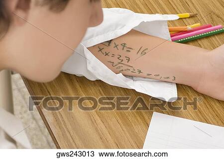 Close-up of a schoolboy copying in an examination View Large Photo Image Stock Image - Close-up of a schoolboy copying in an examination. Fotosearch