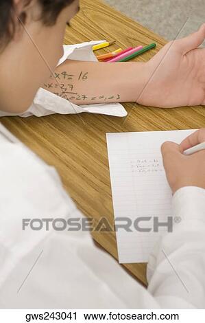 Close-up of a schoolboy copying in an examination View Large Photo Image Stock Image - Close-up of a schoolboy copying in an examination. Fotosearch