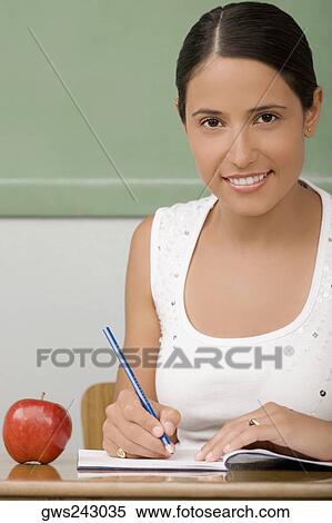 Portrait of a female teacher smiling View Large Photo Image Stock Photography - Portrait of a female teacher smiling. Fotosearch