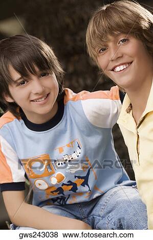 Portrait of two schoolboys smiling together View Large Photo Image Stock Photo - Portrait of two schoolboys smiling together. Fotosearch