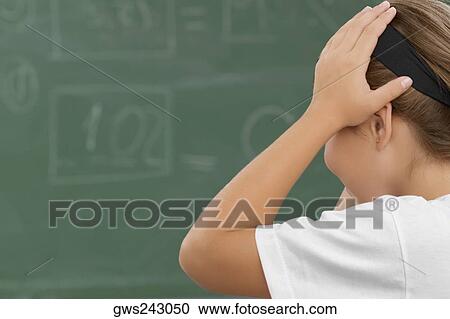 Side profile of a schoolgirl with her hands in her hair View Large Photo Image Stock Image - Side profile of a schoolgirl with her hands in her hair. Fotosearch